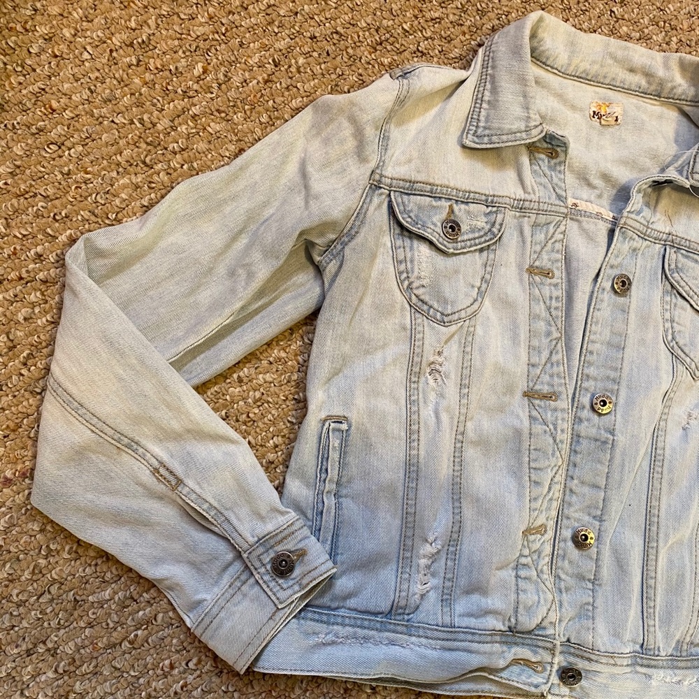 Light distressed denim jacket